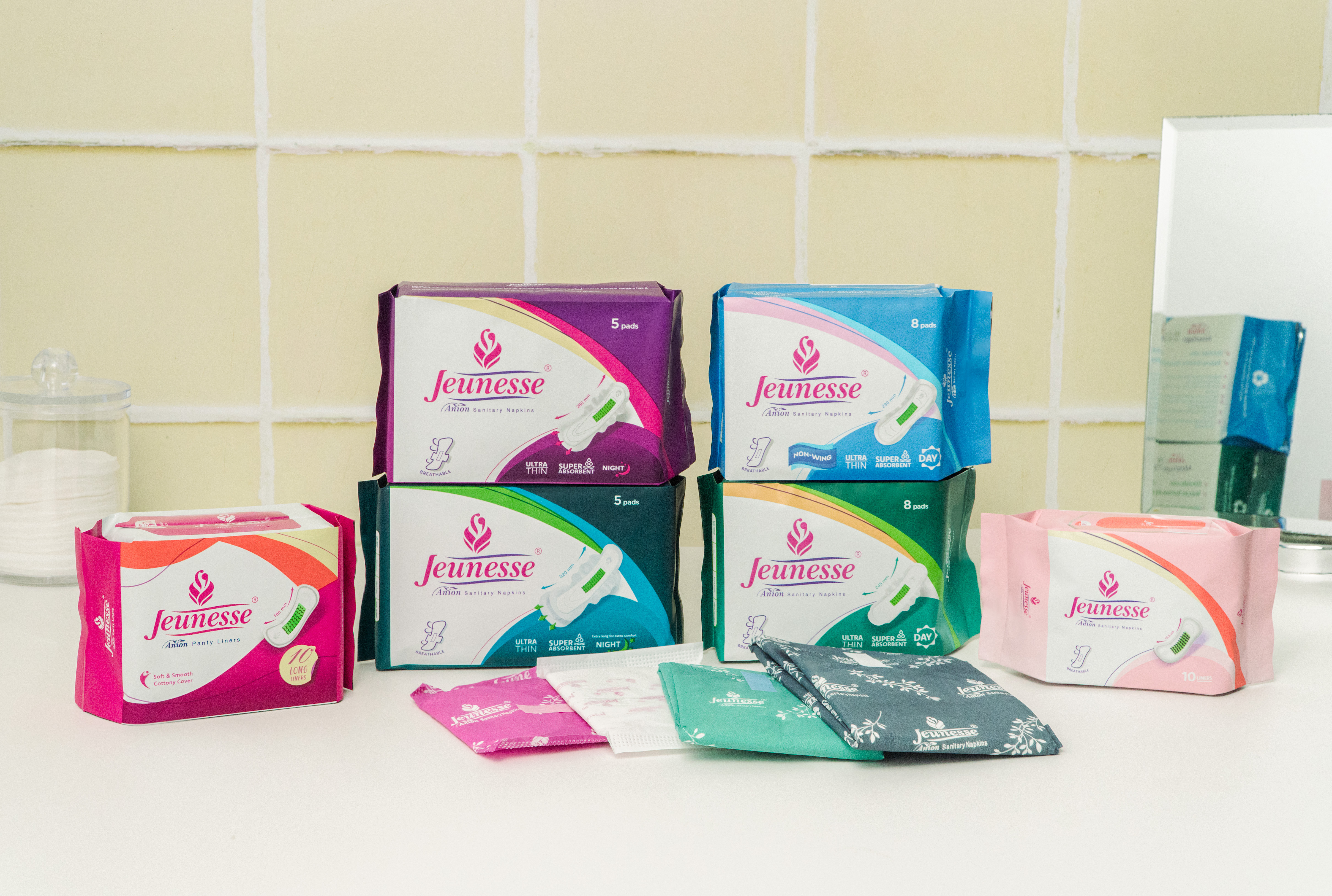 The full range of Jeunesse Anion pads and liners arranged together
